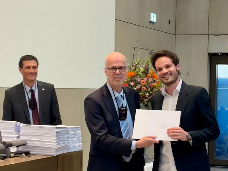 Bryan Charbonnet is presented with the Award for Outstanding Teaching by Early Career Scholars by the Vice-Dean.